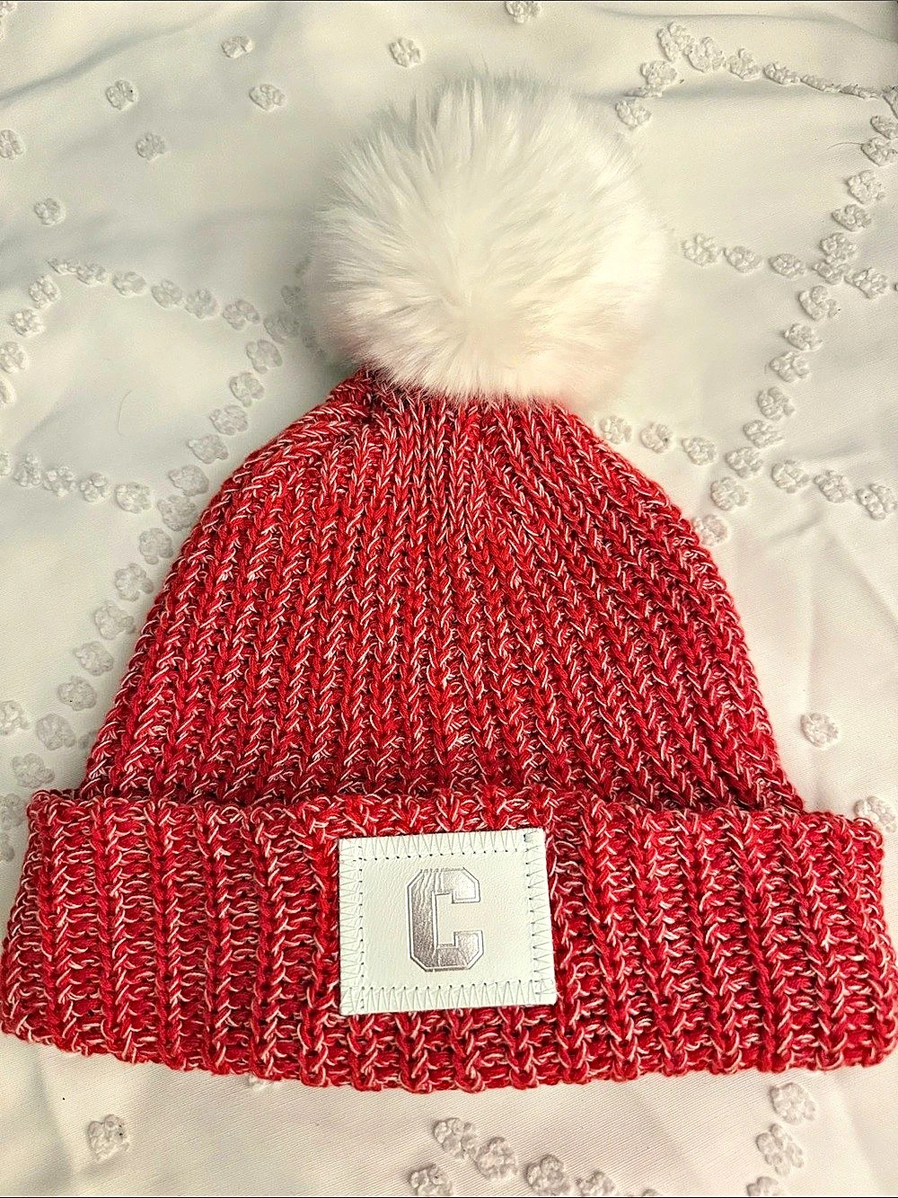 Love Your Melon Red White Fleck Pom Beanie with Leather C Patch (Cornell)